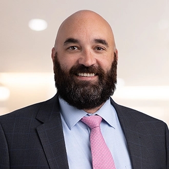 Professional headshot of K. Sam Brooks