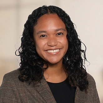 Professional headshot of Nia Burrell