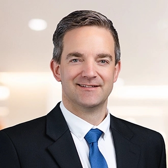 Professional headshot of Benjamin E. Evans