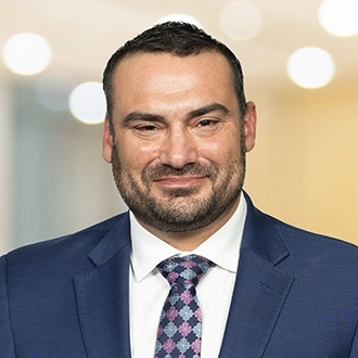 Professional headshot of Jordan D. Factor