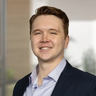 Professional headshot of Kieran L. Falkstrom