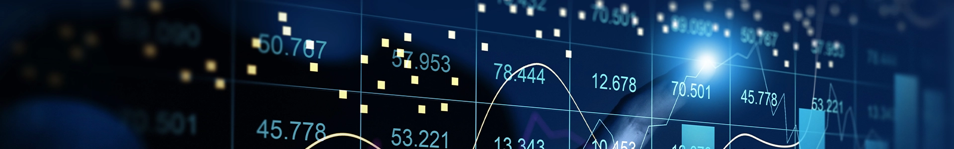 Digital screen displaying numeric data, charts, and fluctuating line graphs in blue light.
