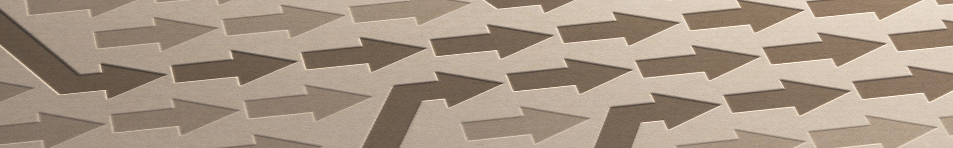 Pattern of embossed arrows on a textured surface, with a few arrows changing direction to symbolize strategic guidance and forward movement.