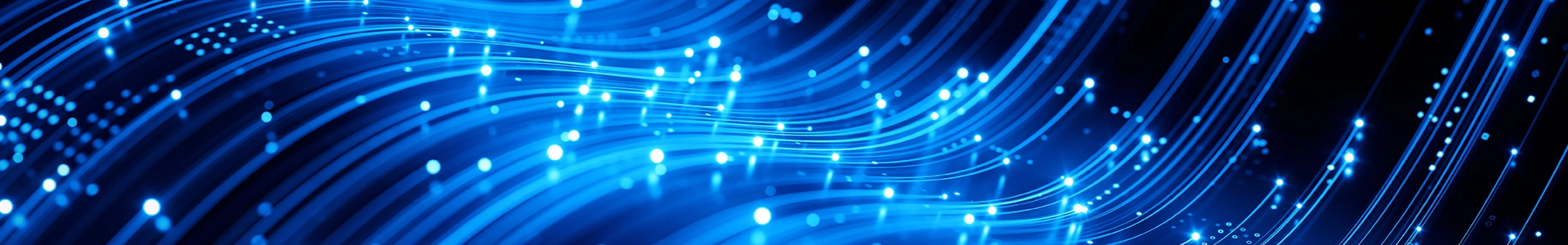 Abstract blue fiber‑optic light trails representing high‑speed data transfer and modern digital technology.