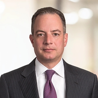 Professional headshot of Reince Priebus