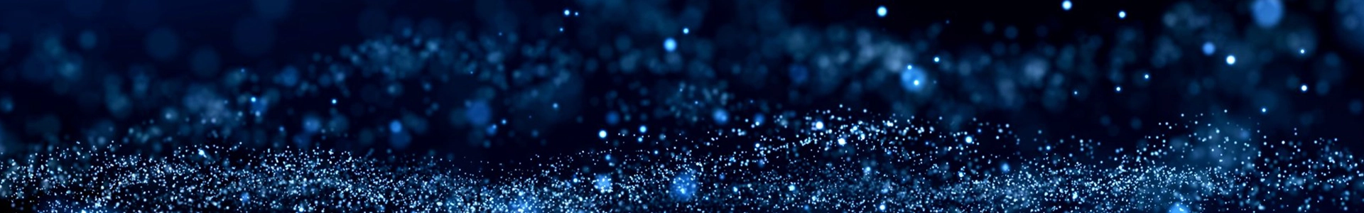 Abstract blue glitter texture with sparkling particles and soft bokeh lights over a dark navy background, creating a magical, dreamy mood.