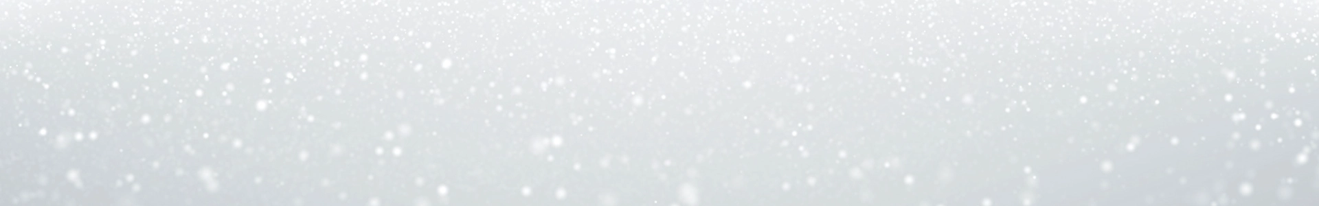 Soft white snow-like specks drift across a pale gray background, creating a calm, wintry, gently sparkling atmosphere.